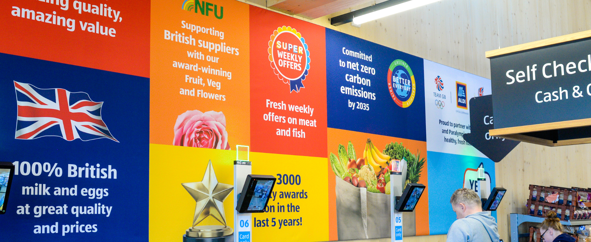 Self checkout and wall graphics in aldi
