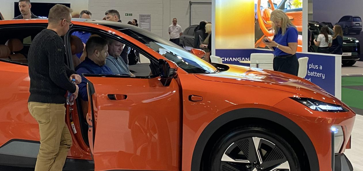 Visitors exploring the Changan Automotive stand at Everything Electric Show 2025, featuring the Deepal S07 electric vehicle designed and delivered by Service Graphics
