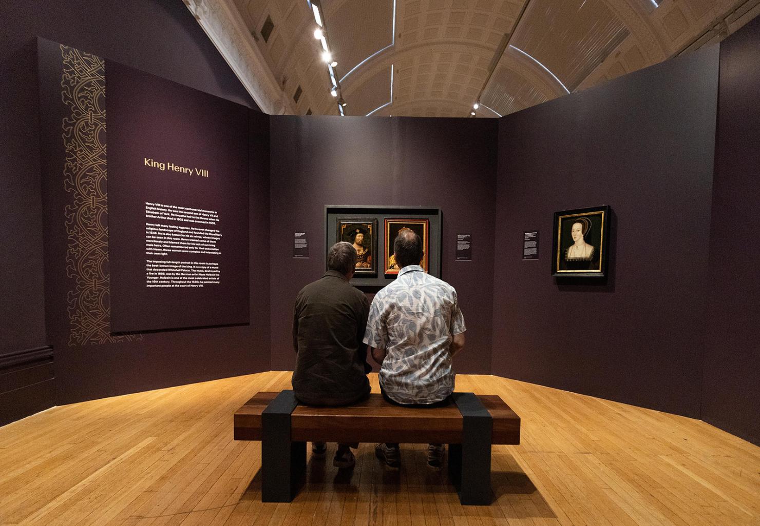 The tudor museum with people sitting