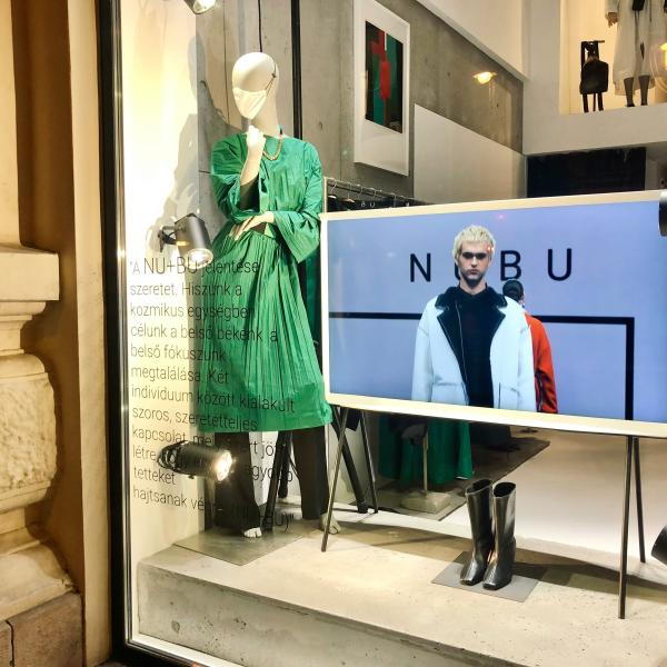 Shop window with digital signage and mannequin