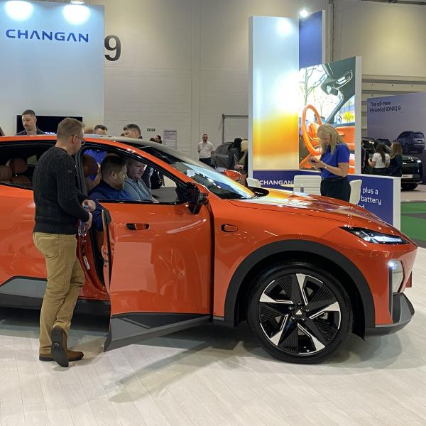 Visitors exploring the Changan Automotive stand at Everything Electric Show 2025, featuring the Deepal S07 electric vehicle designed and delivered by Service Graphics
